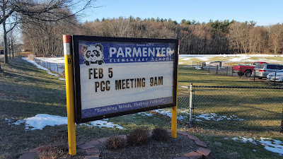 Parmenter School sign announcing PCC meeting on Feb 5