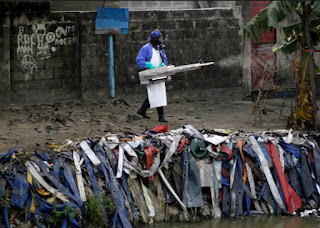 Spraying for Mosquitoes in a shanty town of the DRC Africa Spraying for Mosquitoes in a shanty town of the DRC Africa