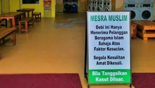 gambar signboard kedai dobi muslim yang mencentuskan kontroversi di Johor sehingga ketua negeri menyamakan perbuatan itu dengan Taliban