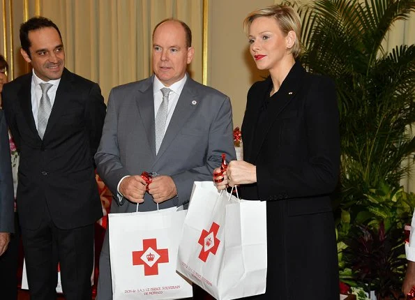 Prince Albert and Princess Charlene distributed gifts to beneficiaries of the Monaco Red Cross on the occasion of the national holiday