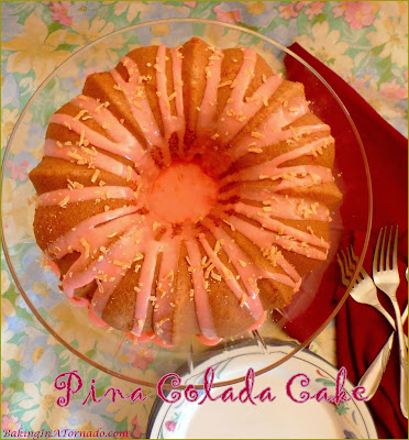 Pina Colada Cake, this quick and easy bunt cake has flavors that take you to the beach on a summer day. Mix, bake, glaze and you’re done. | Recipe developed by www.BakingInATornado.com | #recipe #cake