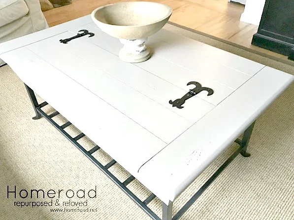 Painted coffee table in neutral color with iron details