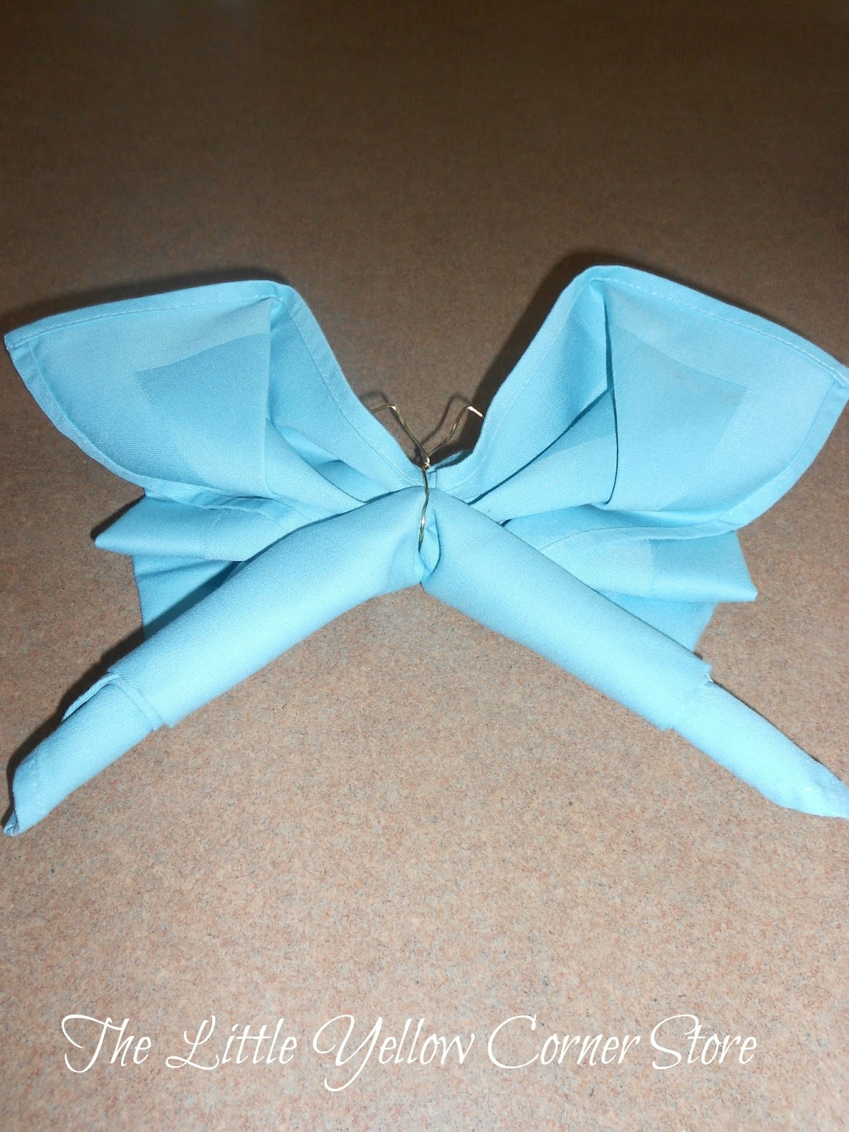 The Little Yellow Corner Store Butterfly Napkin Folding Tutorial