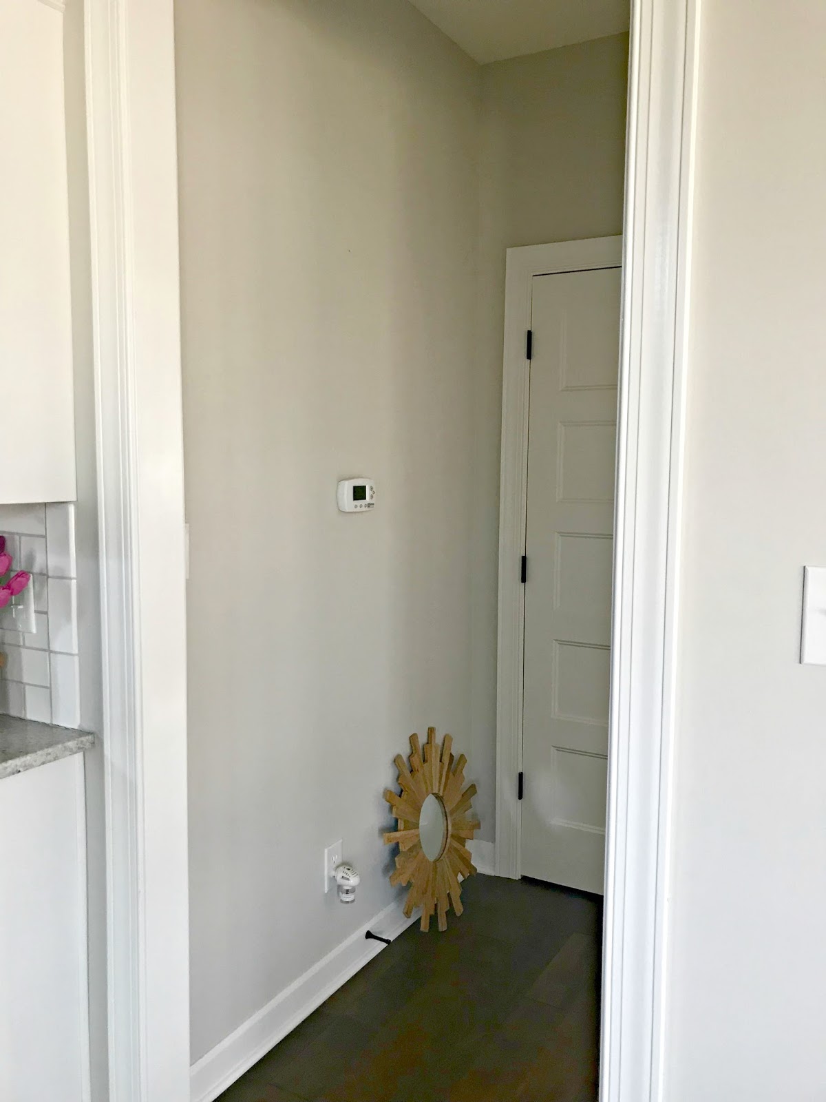 Art wall around the thermostat (and a hanging art hack) from Thrifty