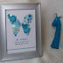 Cadre naissance et petite girafe hochet