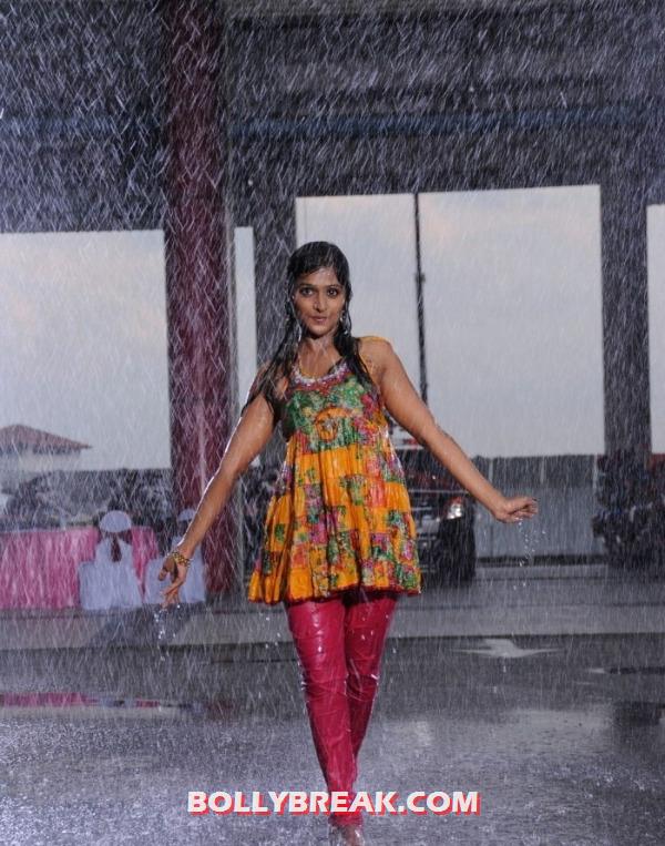 Ramya looking tempting in a yellow and red outfit getting wet - ramya nambesan dancing in therain