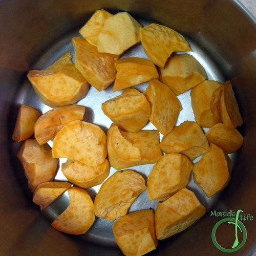 Morsels of Life - Slow Cooker BBQ Chicken Step 3 - Place sweet potatoes on the bottom of your slow cooker.