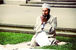 A young Muslim man praying