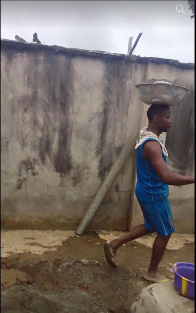 Photos of unemployed Nigerian graduate working as a bricklayer