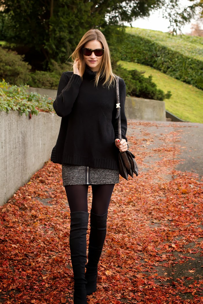 Vancouver Fashion Blogger, Alison Hutchinson, is wearing a black H&M turtleneck sweater, grey Aritzia Skirt, Black nine west over-the-knee boots, a silver botkier valentina bag and Sass & Bide sunglasses