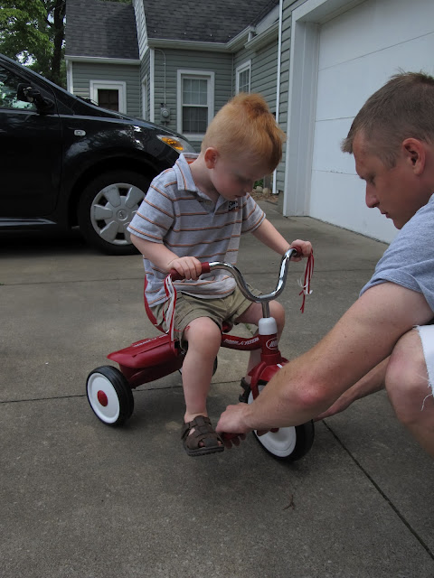 Porter & Daddy Checking out the Bike