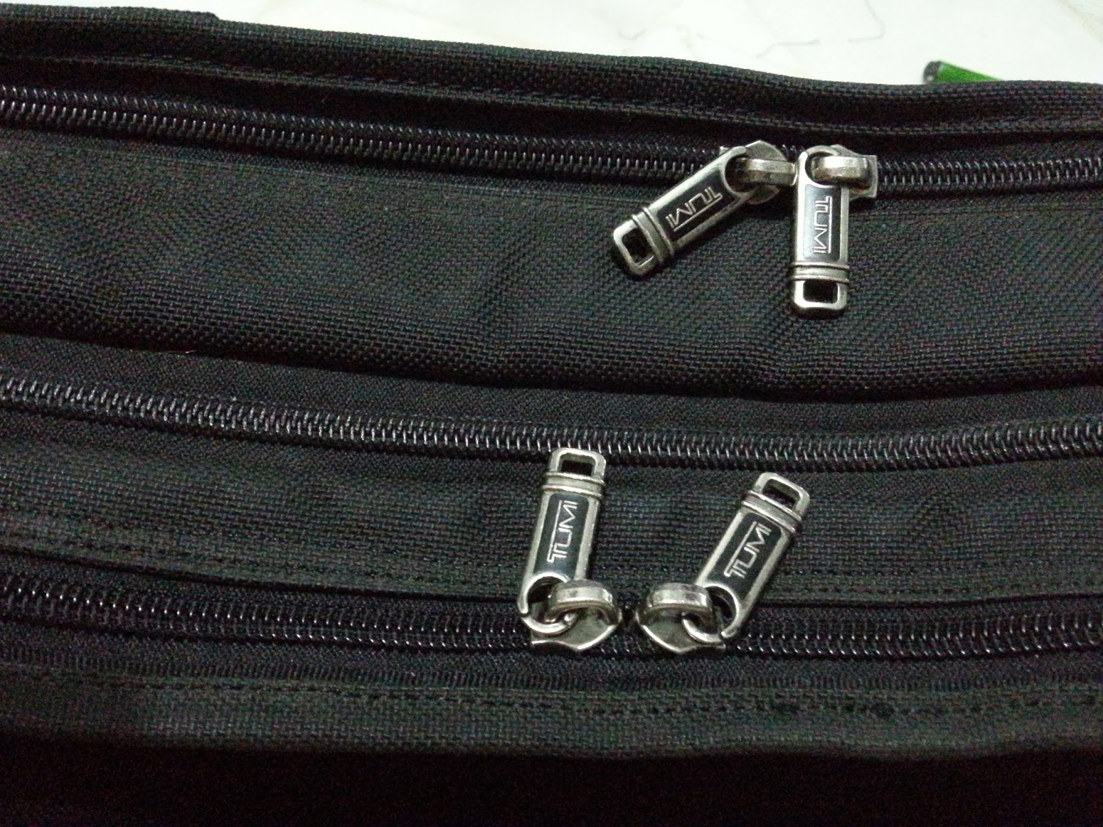 Tumi Bag Repair, tumi luggage wheel replacement, zipper repair, bag
