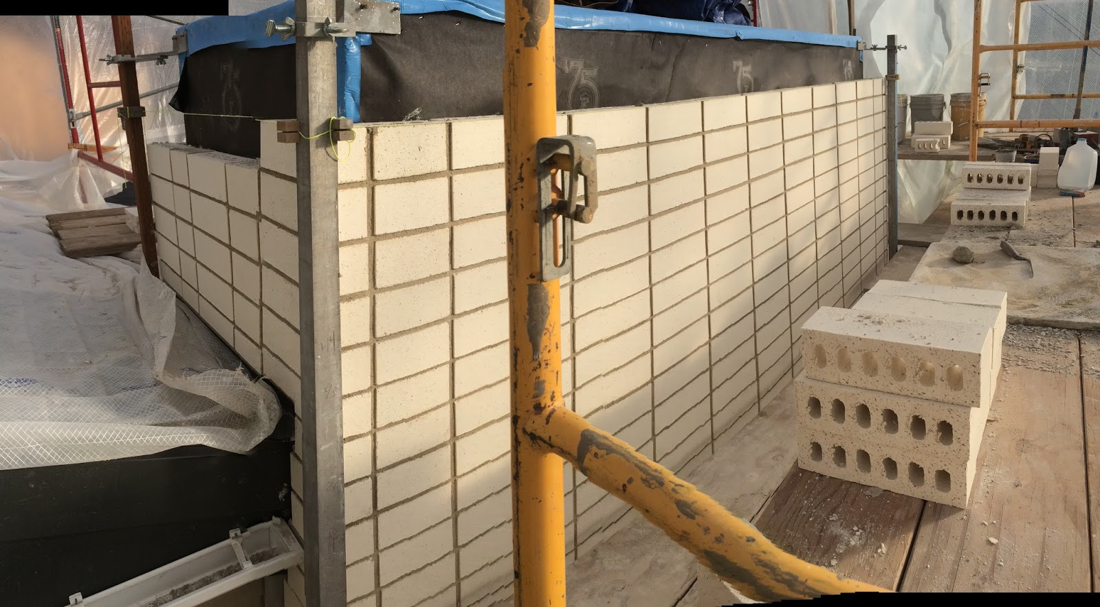 BOISINEAU MASONRY Stacked Bond Brick Chimney in Northwest Crossing