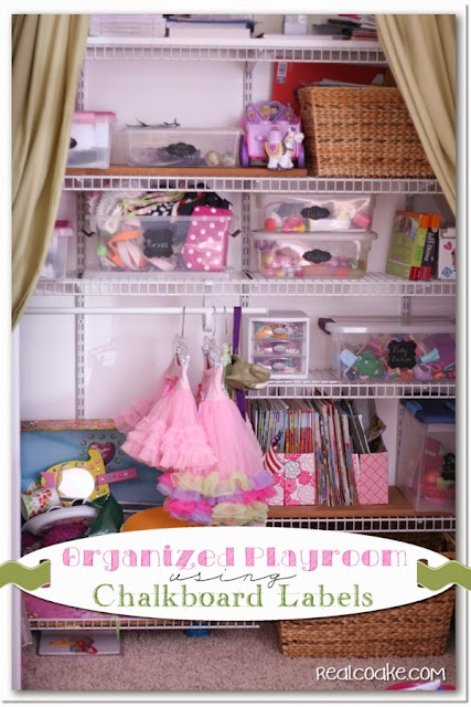 An organized playroom using chalkboard labels to help toy storage stay organized. #Organizing #Playroom #Chalkboard