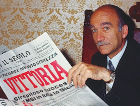 Giorgio Almirante in 1971, reading about his party's success in regional elections in Sicily