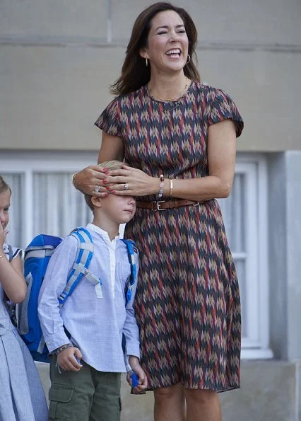 Crown Princess Mary's youngest children, Prince Vincent and Princess Josephine started Tranegård School. Mary wore dress
