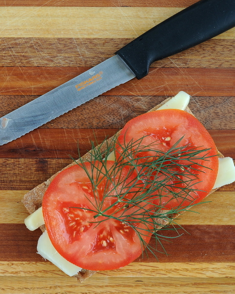 For sharp, clean tomato slices (and so many other kitchen cutting tasks), pick up a tomato knife, a short serrated knife. Another Quick Tip ♥ KitchenParade.com.