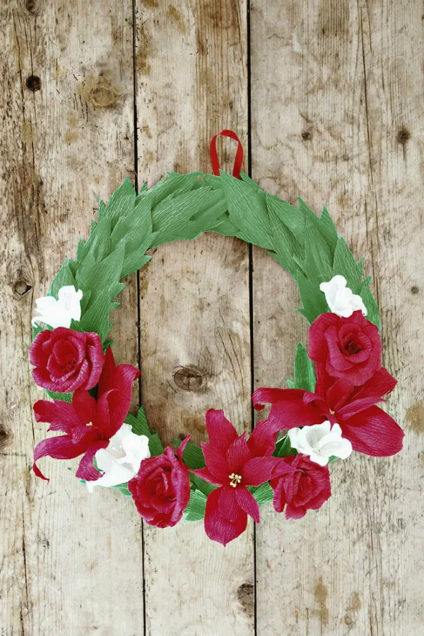 red white, and green crepe paper flowers Christmas wreath