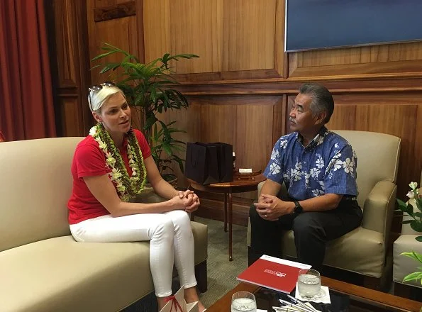 Princess Charlene of Monaco visited Honolulu, Hawaii met Governor David Idge. She wore red shirt and white pants