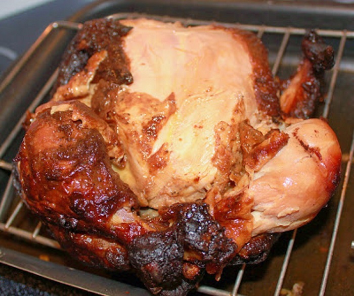 delicious juicy roasted chicken on a broiler pan perfectly cooked