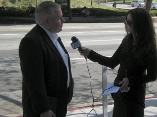 Gene Hoffman talks to a reporter.