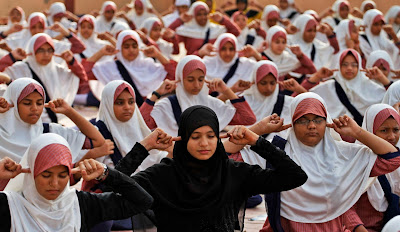 Indian Muslim students practice yoga at a school ahead of first International Yoga Day in Ahmedabad, India