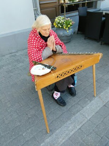 A Old Lady musician in Riga Old Town.