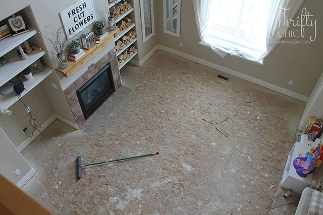 Why we chose laminate versus hard wood flooring. Plus, a glimpse into the installation process!