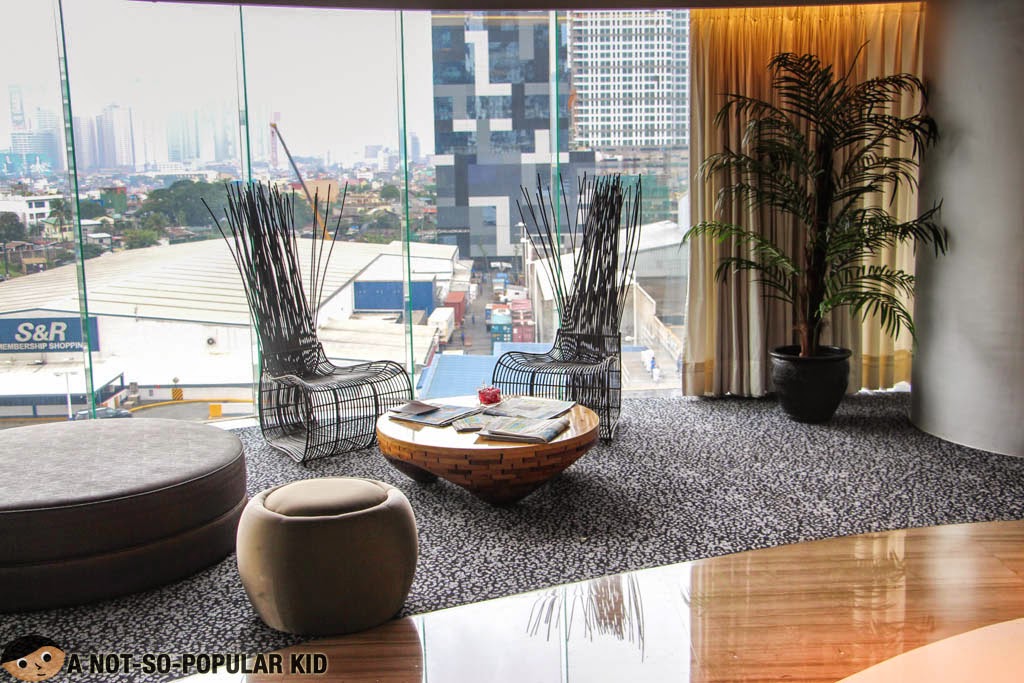 The lobby of F1 Hotel Manila with a good view of the S&R and W Tower