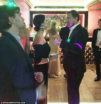 10 Actor Leonardo DiCaprio can't keep his eyes or hands off mystery lady at party (photos)