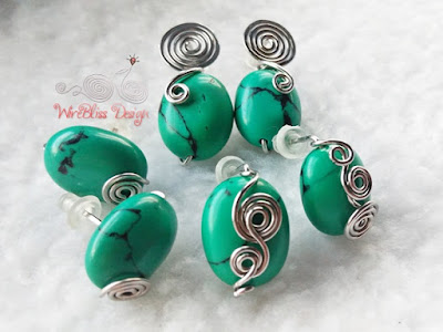 Turquoise wire wrapped earrings with lots of swirls