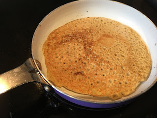 gluten free buckwheat pancake in a small frying pan. Corina Duyn Blogger