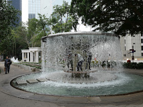 Playing in the fountain at Hong Kong Park
