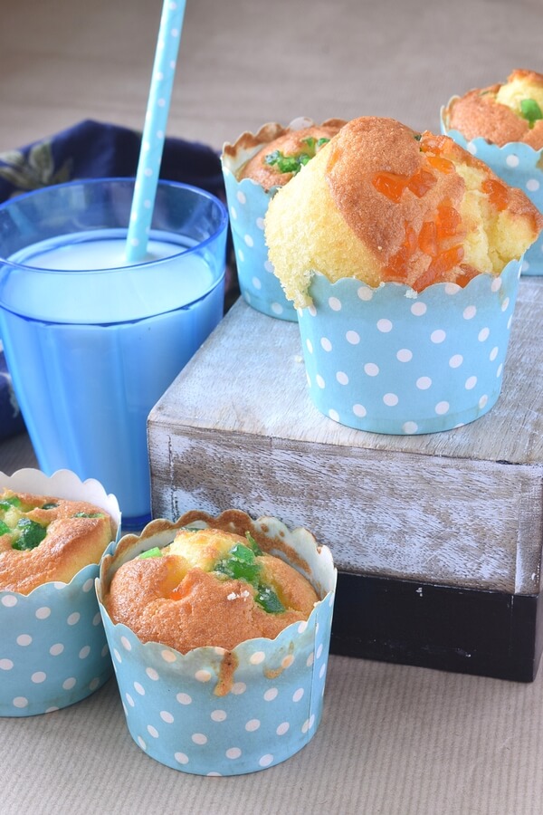 Soft Pineapple Muffins topped with tutti fruity served with milk