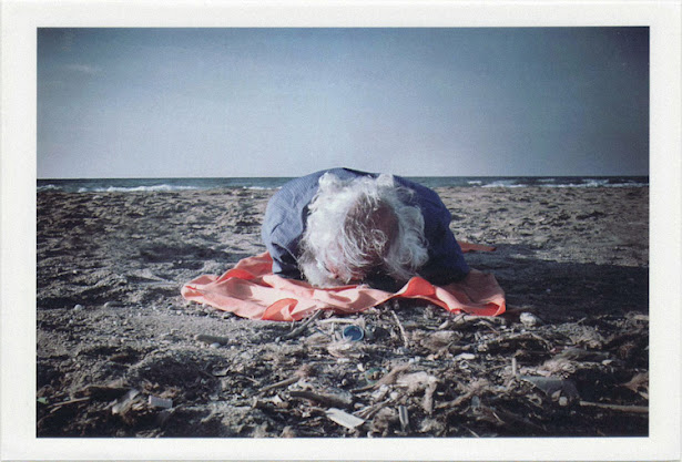 dirty photos - time - cretan landscape photo of old man sleeping at the beach