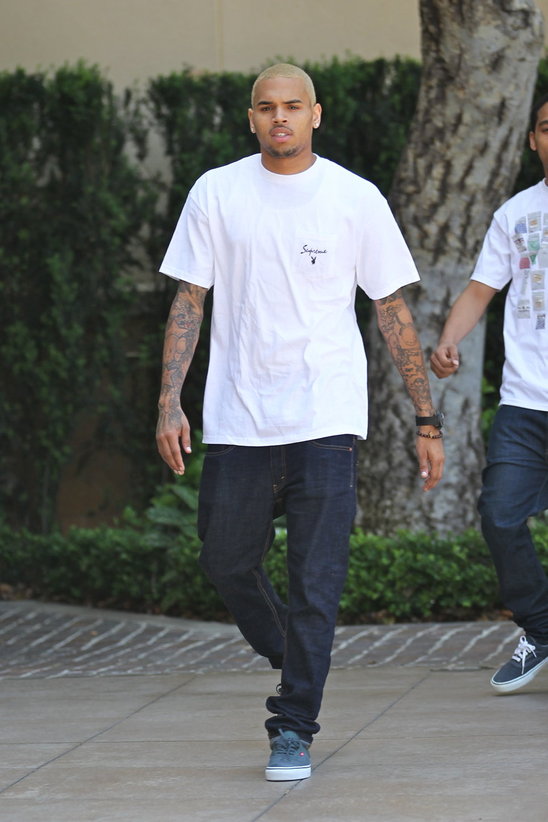 Chris Brown shows off neck tattoo but denies its Rihannas beaten face   Marie Claire UK