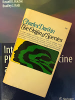 The Origin of Species, by Charles Darwin, superimposed on Intermediate Physics for Medicine and Biology.