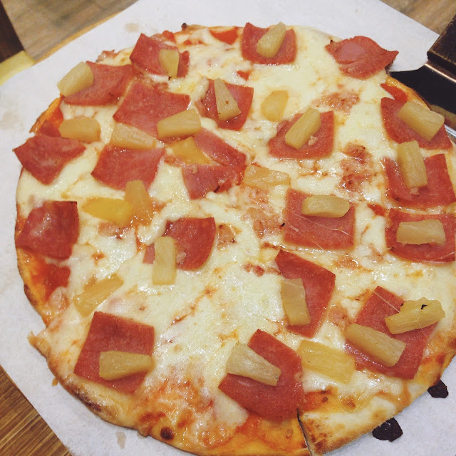 pizza with pineapple tidbits and ham