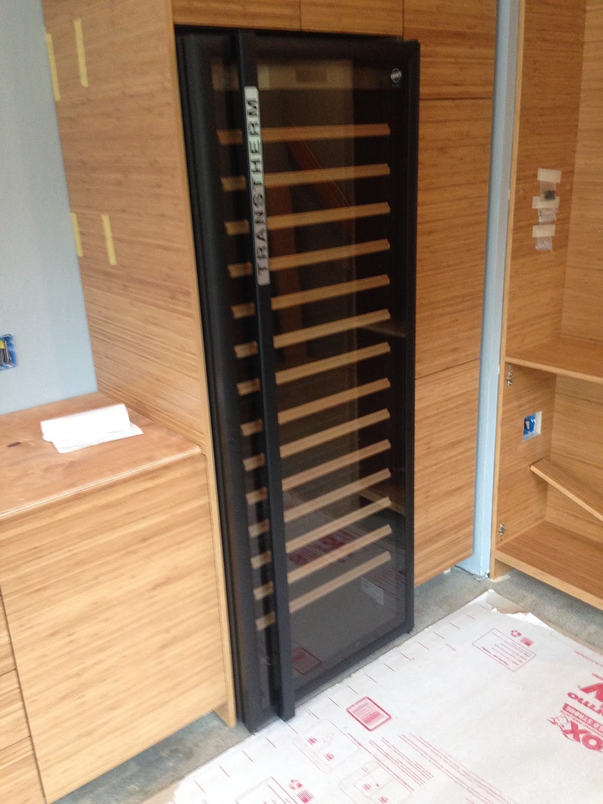 Boomerang Kitchen: Cabinets and Wine Fridge