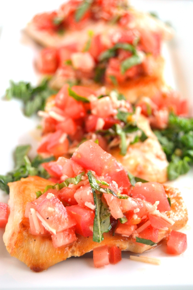 Bruschetta Chicken is ready in just 20 minutes and is the perfect fresh and flavorful recipe with tomatoes, garlic, Parmesan cheese and basil! www.nutritionistreviews.com
