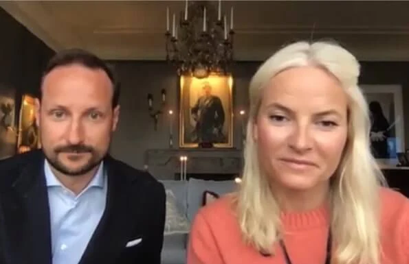 Crown Prince Haakon and Crown Princess Mette-Marit contacted with Norwegian Council for Mental Health. pink sweater