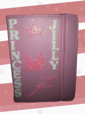 Jillyn's pink, glittery, customized Kindle.