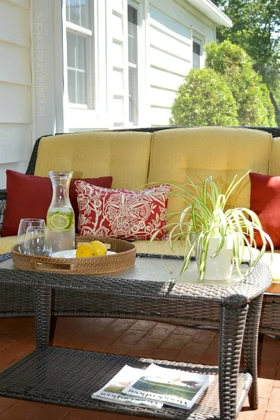 Screened in porch with wicker furniture