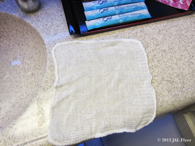 JAL provides linen towel in its First Class lavatory.