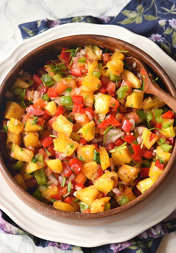 easy pineapple jalapeno salsa served in a wooden bowl