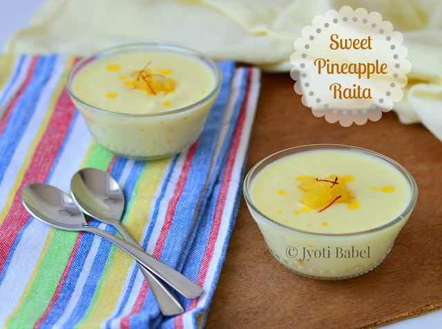 Sweet Pineapple Raita makes for a great accompaniment to any meal. Mildly sweetened yoghurt flavoured with cardamom, saffron with tiny chunks of sweetened canned pineapple, this sweet pineapple raita is a treat in itself. Recipe at www.jyotibabel.com