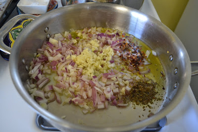 Start pink vodka sauce by sauteing onions, garlic and oregano in olive oil.
