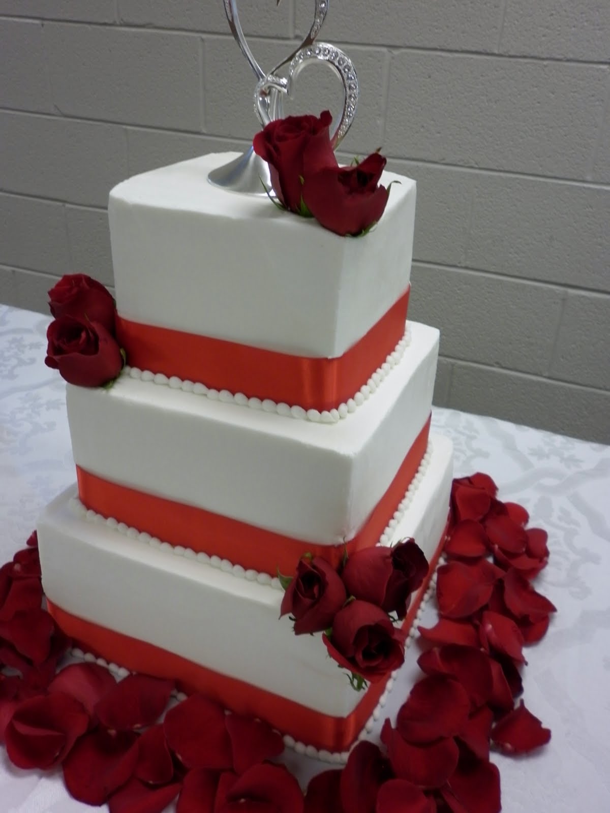 'Tis So Sweet Cakes Wedding cake with Red Ribbon