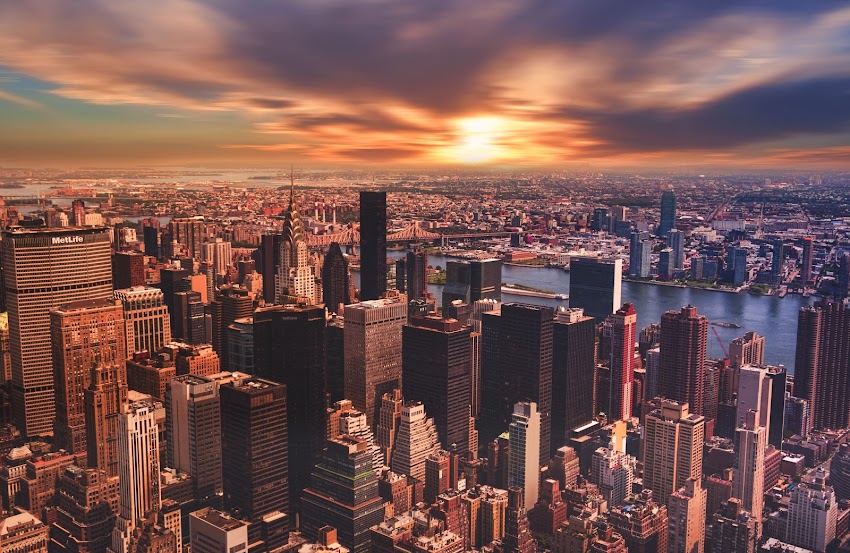 High Angle View of Cityscape Against Cloudy Sky High Angle View of Cityscape Against Cloudy Sky