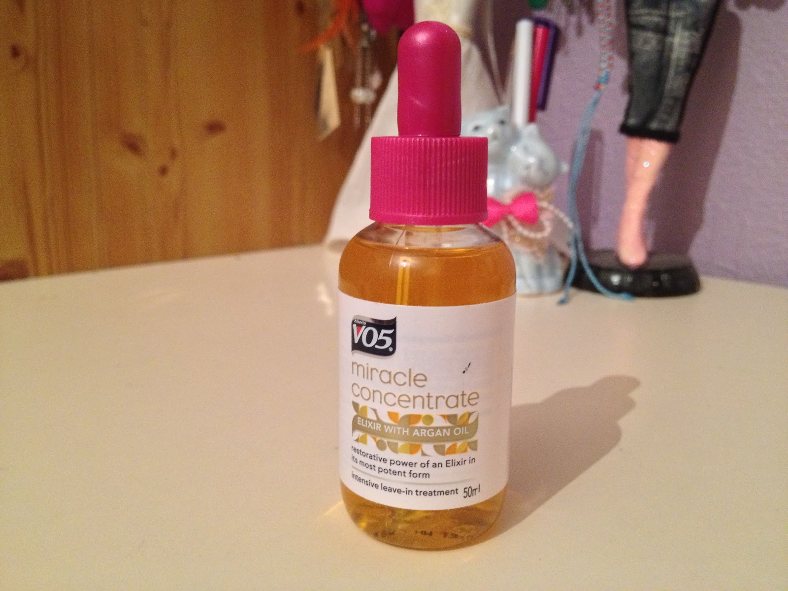 Hair oil in a bottle with a pipette